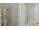 Bright bathroom showcasing a toilet and a modern glass-enclosed shower at 2537 Cedar Hedge Ct, Apex, NC 27523