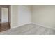 Neutral bedroom with carpet, closet, and an open doorway to the rest of the house at 2537 Cedar Hedge Ct, Apex, NC 27523