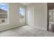 Bedroom featuring neutral walls, carpet flooring, closet, and lots of natural light at 2537 Cedar Hedge Ct, Apex, NC 27523