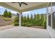Inviting covered patio with ceiling fan and views of the landscaped backyard at 2537 Cedar Hedge Ct, Apex, NC 27523
