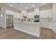 Gourmet kitchen features stainless steel appliances and a large island at 2537 Cedar Hedge Ct, Apex, NC 27523