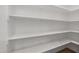 Walk-in pantry with white shelving at 2537 Cedar Hedge Ct, Apex, NC 27523