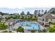 Beautiful community pool featuring a splash fountain, lounge chairs, and a shaded pergola at 2537 Cedar Hedge Ct, Apex, NC 27523