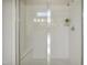 Clean, modern shower with white subway tile, a built-in seat, and a sleek glass enclosure at 2537 Cedar Hedge Ct, Apex, NC 27523