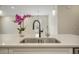Close-up view of a sink, faucet, and white countertop at 2537 Cedar Hedge Ct, Apex, NC 27523