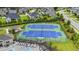 Overhead view of community tennis courts with pristine blue and green playing surfaces at 2537 Cedar Hedge Ct, Apex, NC 27523