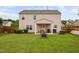 Large backyard with patio, fire pit, and well-maintained lawn at 2604 Fortrose Ln, Fuquay Varina, NC 27526