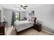 Comfortable bedroom with a ceiling fan, warm carpet, and natural light at 2604 Fortrose Ln, Fuquay Varina, NC 27526