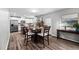 Eat-in kitchen featuring a table, seating for four and wood-style flooring at 2604 Fortrose Ln, Fuquay Varina, NC 27526
