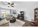 Comfortable living room with a ceiling fan, fireplace and neutral furnishings at 2604 Fortrose Ln, Fuquay Varina, NC 27526