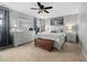 Serene main bedroom with white furniture, ceiling fan, and soft carpeting at 2604 Fortrose Ln, Fuquay Varina, NC 27526