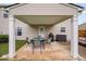 Covered patio includes an outdoor dining set and grill perfect for entertaining at 2604 Fortrose Ln, Fuquay Varina, NC 27526