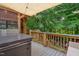 Comfortable back deck with a hot tub overlooking a natural background at 275 Eagle Stone Rdg, Youngsville, NC 27596