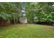 Spacious backyard with a well-maintained lawn and a shed for extra storage at 275 Eagle Stone Rdg, Youngsville, NC 27596