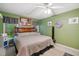 Inviting bedroom boasts a comfortable bed, soft carpet, ceiling fan, and bright natural light at 275 Eagle Stone Rdg, Youngsville, NC 27596