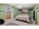 Inviting bedroom with attached bathroom boasts a comfortable bed, soft carpet, ceiling fan, and bright natural light at 275 Eagle Stone Rdg, Youngsville, NC 27596