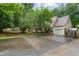 Charming home with a two-car garage and long driveway surrounded by lush trees at 275 Eagle Stone Rdg, Youngsville, NC 27596