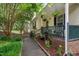 Inviting front porch decorated with hanging plants and outdoor decor at 275 Eagle Stone Rdg, Youngsville, NC 27596