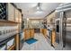 Spacious kitchen showcases stainless steel appliances, granite countertops, wooden cabinets, and an adjacent dining area at 275 Eagle Stone Rdg, Youngsville, NC 27596