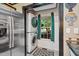 Convenient laundry area features a stacked washer and dryer, natural light from the window, and neutral tones at 275 Eagle Stone Rdg, Youngsville, NC 27596