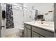 Bright bathroom features a double vanity, bathtub and shower combo and decorative accents at 290 Quarter Gate Trce, Chapel Hill, NC 27516