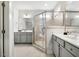 Elegant bathroom features dual vanities and a seamless glass shower enclosure at 290 Quarter Gate Trce, Chapel Hill, NC 27516