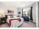 Bright bedroom featuring natural light from the window, light carpet, and stylish decor at 290 Quarter Gate Trce, Chapel Hill, NC 27516