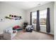 Sunlit ' room features playful decor and comfortable seating areas by large windows at 290 Quarter Gate Trce, Chapel Hill, NC 27516