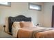 Comfortable bedroom with a upholstered headboard, soft lighting, and a cozy atmosphere at 290 Quarter Gate Trce, Chapel Hill, NC 27516