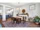 Inviting dining room with wood table, decorative rug, and natural light at 290 Quarter Gate Trce, Chapel Hill, NC 27516