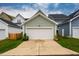 Detached two-car garage with a concrete driveway, set amongst well-maintained neighboring homes at 290 Quarter Gate Trce, Chapel Hill, NC 27516