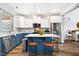 Bright kitchen with a kitchen island, stainless steel appliances, and stylish pendant lights at 290 Quarter Gate Trce, Chapel Hill, NC 27516