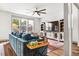 Bright living room with large windows and a ceiling fan at 290 Quarter Gate Trce, Chapel Hill, NC 27516