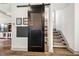 Walk-in pantry featuring a black sliding barn door with a chalkboard for organizing weekly meals at 290 Quarter Gate Trce, Chapel Hill, NC 27516