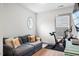 Comfortable sitting area with a couch and exercise bike, perfect for relaxation at 290 Quarter Gate Trce, Chapel Hill, NC 27516