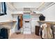 Well-organized walk-in closet with multiple shelves and hanging rods for ample storage at 290 Quarter Gate Trce, Chapel Hill, NC 27516