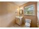 Bathroom with a window, vanity, mirror, and toilet at 3114 Alabama Ave, Durham, NC 27705