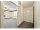 Inviting entryway leading to a living room with neutral paint and carpet at 3114 Alabama Ave, Durham, NC 27705