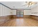 Bright living room with wood-look floors and French doors leading to deck at 3114 Alabama Ave, Durham, NC 27705