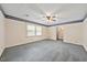 Spacious living room with natural light, neutral walls, and carpet at 3114 Alabama Ave, Durham, NC 27705