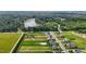 Aerial view of a neighborhood with houses, and lake is seen in the background at 319 Brinkley Cir, Mebane, NC 27302
