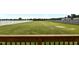 Large, level backyard enclosed by a white vinyl fence, offering ample space for recreation at 319 Brinkley Cir, Mebane, NC 27302