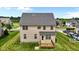 Spacious backyard with a well-maintained lawn and a wooden deck, perfect for outdoor relaxation at 319 Brinkley Cir, Mebane, NC 27302