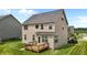 Spacious backyard featuring a wooden deck, lush lawn, and views of the home's exterior at 319 Brinkley Cir, Mebane, NC 27302