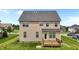 Home backyard featuring a wooden deck, well-kept lawn and tidy exterior at 319 Brinkley Cir, Mebane, NC 27302