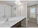 This spacious bathroom features a large mirror, vanity and great lighting at 319 Brinkley Cir, Mebane, NC 27302