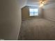Bedroom with neutral tones, carpeted floor and sloped ceiling providing a cozy space at 319 Brinkley Cir, Mebane, NC 27302
