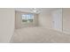 Bright bedroom with neutral walls, carpeted floors, and a window offering natural light at 319 Brinkley Cir, Mebane, NC 27302