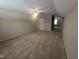 Bedroom with neutral tones, ceiling fan and sloped ceiling providing a cozy space at 319 Brinkley Cir, Mebane, NC 27302