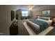 Well-designed bedroom featuring stylish furnishings, a large bed, mounted televisions, and decor at 319 Brinkley Cir, Mebane, NC 27302